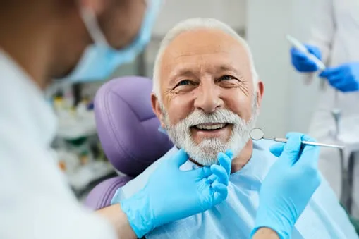 mature man at dentists office chair
